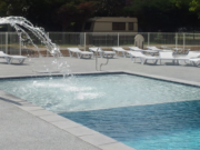 Toro XL coping stone at a shallow area with a fountain