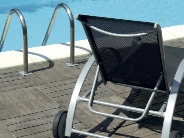 Woodstyle coping stone by a pool