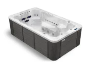 Aquas swim spa with white marble and gray cladding, view from above and the side