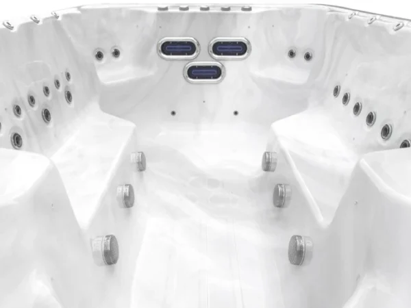 Lengthwise view of an Aquas swim spa toward the three oval jets at the end