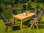 Garden table with chairs with Graphite cushions on a green lawn