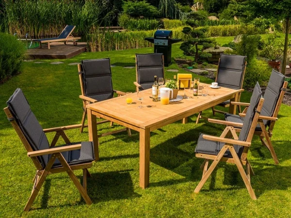 Garden table with chairs with Graphite cushions on a green lawn