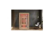 Infrared sauna Marimex POPULAR 2003 L in an interior next to a dark wall, an armchair and a lamp, with red LED lighting