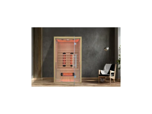 Infrared sauna Marimex POPULAR 2003 L in an interior next to a dark wall, an armchair and a lamp, with red LED lighting