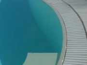 Flexstone stone overflow grate along a curved wall