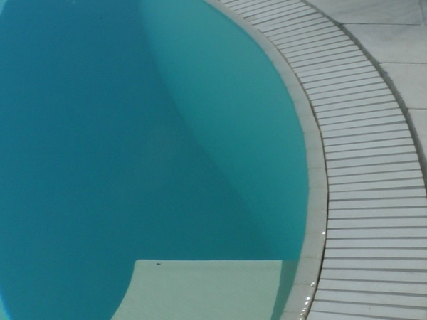 Flexstone stone overflow grate along a curved wall