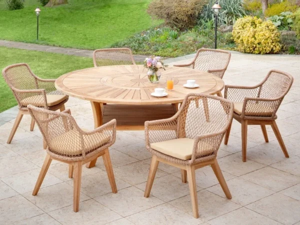 Colosseum round garden table with light Olivia armchairs, flowers and juice