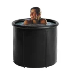 Round cold plunge tub 350 l, Ø90 × 75 cm, with a smiling woman in the water, front view