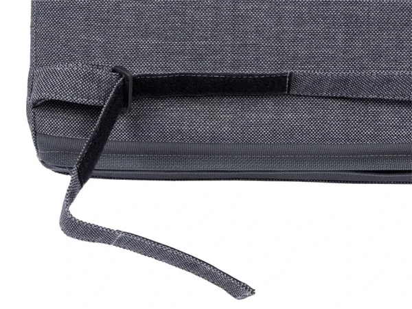 Hook-and-loop strap with a plastic ring on the bottom edge of an Avantgarde cushion