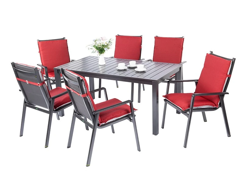 Compact garden table set for six with chairs with red cushions