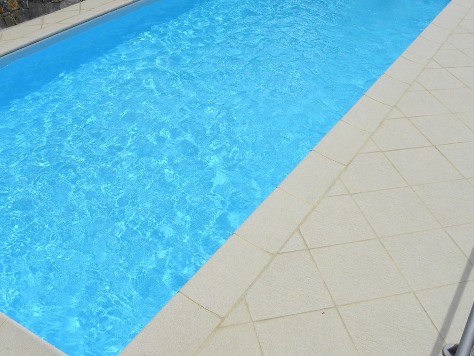 Oasi paving close-up by the water