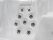 Seat with nine jets and a headrest in an Aquas swim spa, white marble